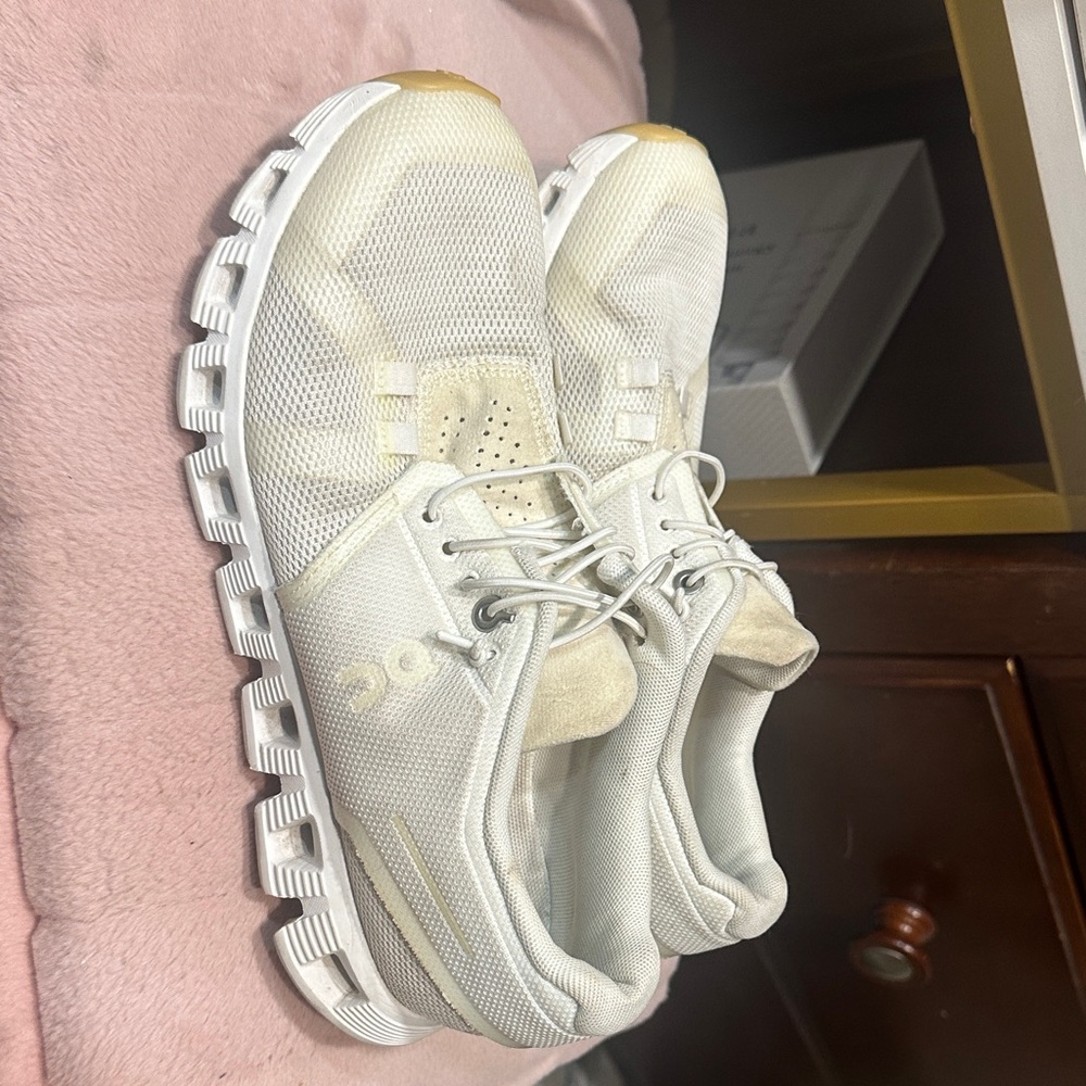 On Running Cream and White Athletic Shoes